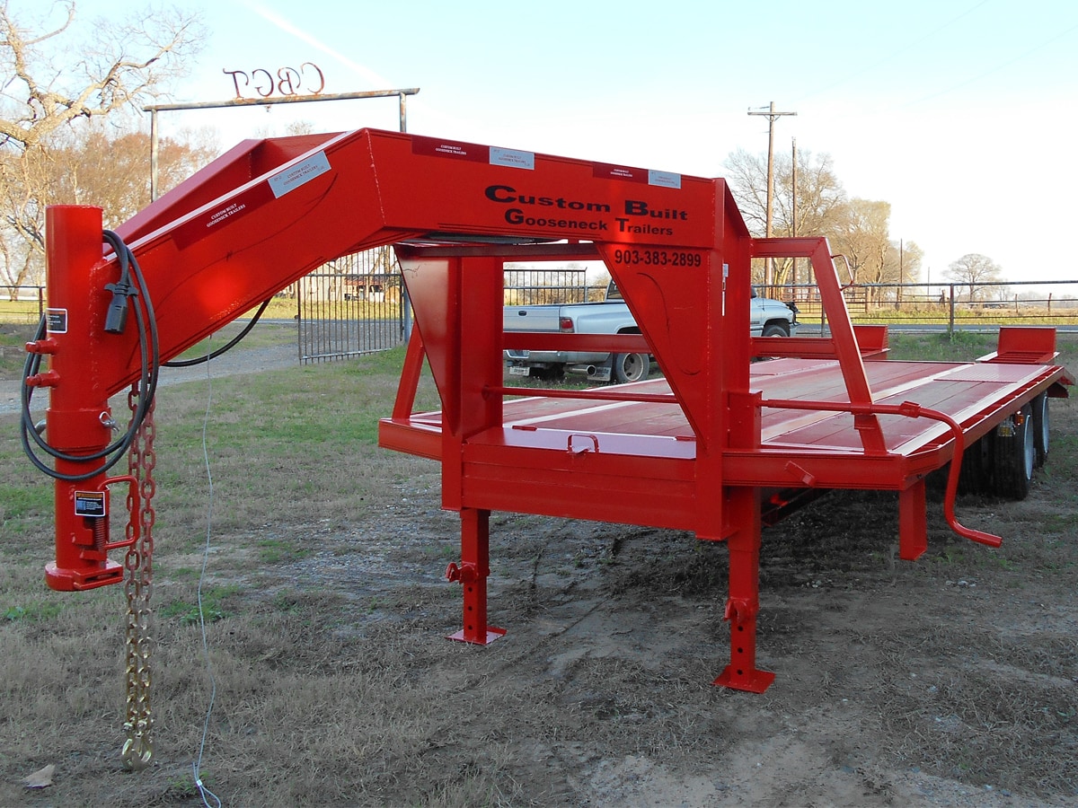 Red, 32 Foot, Pierced Frame Gooseneck Trailer with HD Ramps built by Custom Built Gooseneck Trailers