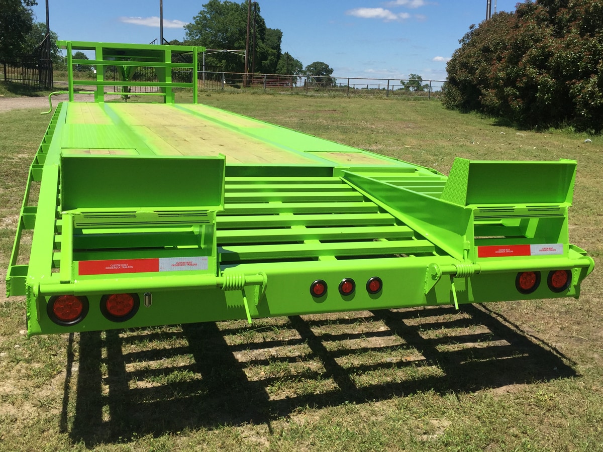 Rear View of a Green, 35 Foot, Pierced Frame Upper Deck Trailer with a Tool Box and HD Ramps built by Custom Built Gooseneck Trailers