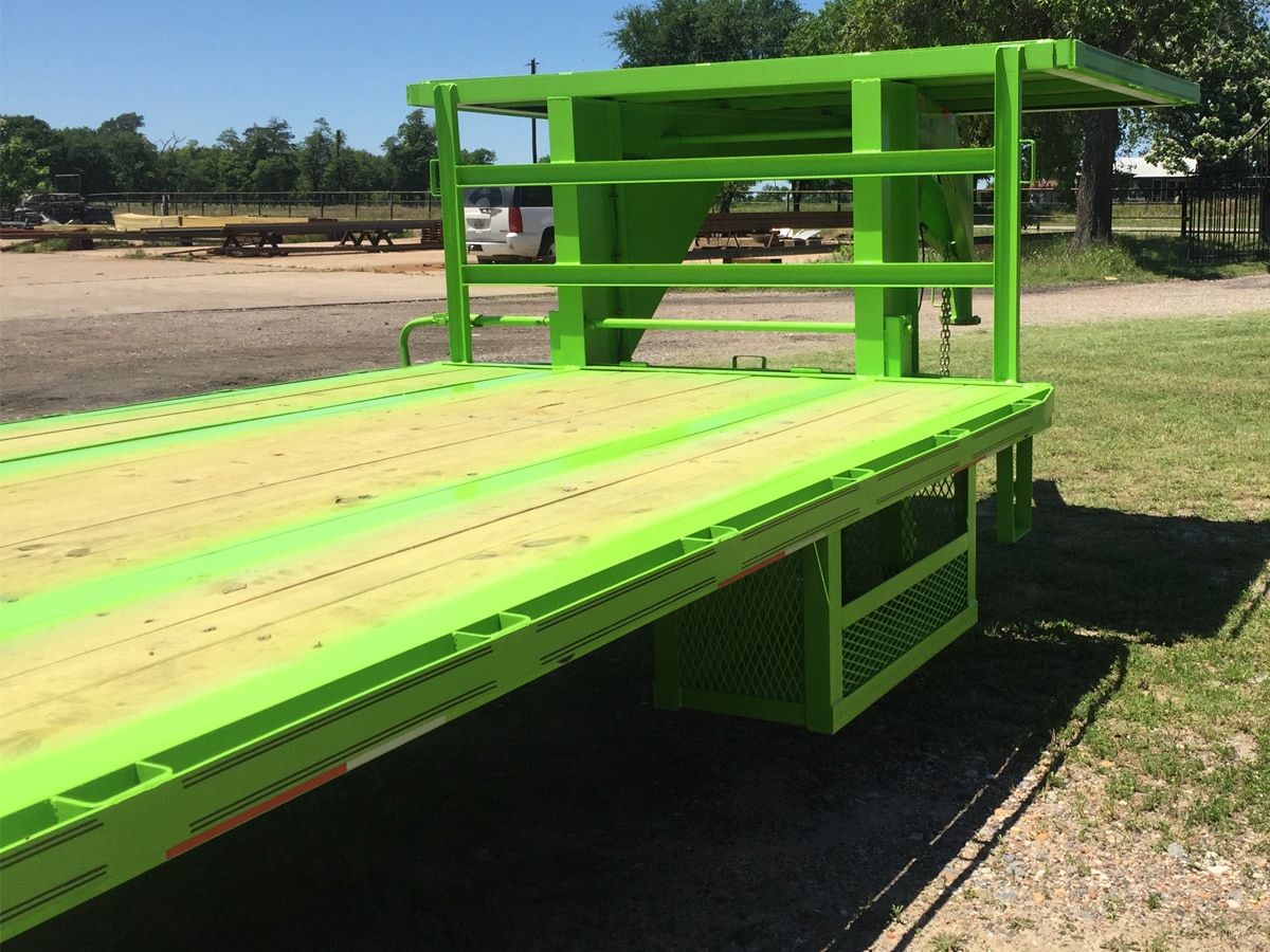 Side View of a Green, 35 Foot, Pierced Frame Upper Deck Trailer with a Tool Box and HD Ramps built by Custom Built Gooseneck Trailers
