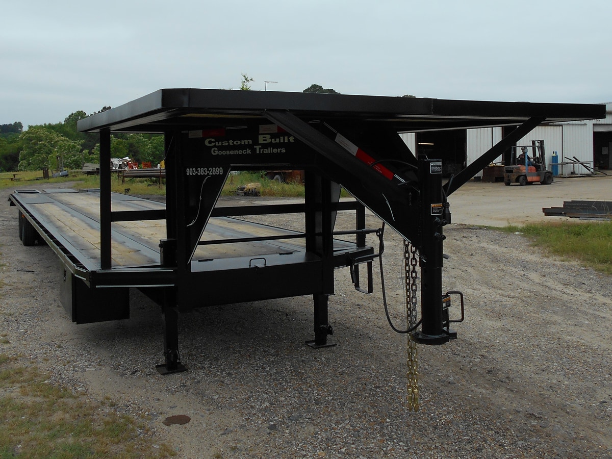 Black, 48 Foot, Pierced Frame Upper-Deck Trailer with a Tool Box, Pop-Up, and Two Ramps built by Custom Built Gooseneck Trailers