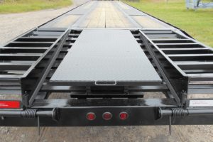 Rear View of a Black, 48 Foot, Pierced Frame Upper-Deck Trailer with a Tool Box, Pop-Up, and Two Ramps built by Custom Built Gooseneck Trailers